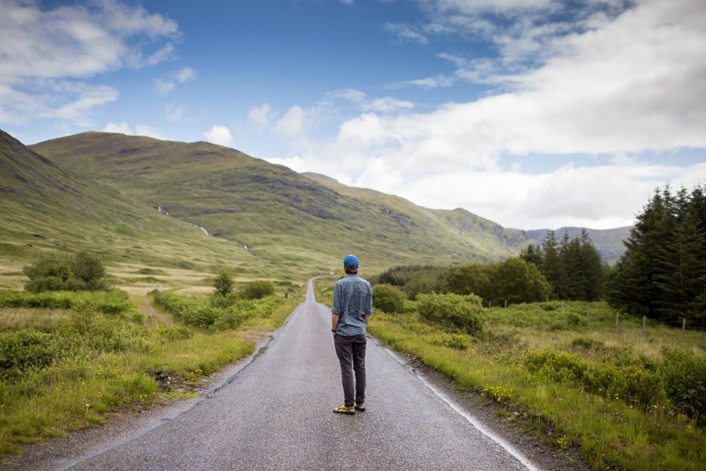 man-standing-on-road