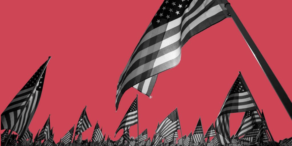 Many American flags against a red background. Ways to celebrate Memorial Day sober.